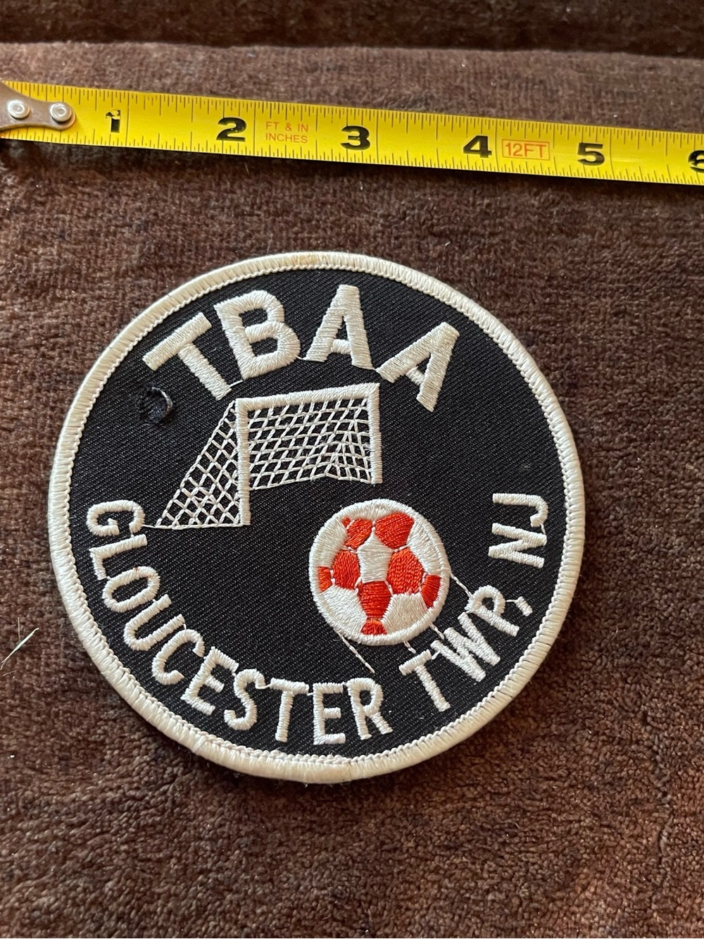 tba Black and White Soccer Patch with Red Accent